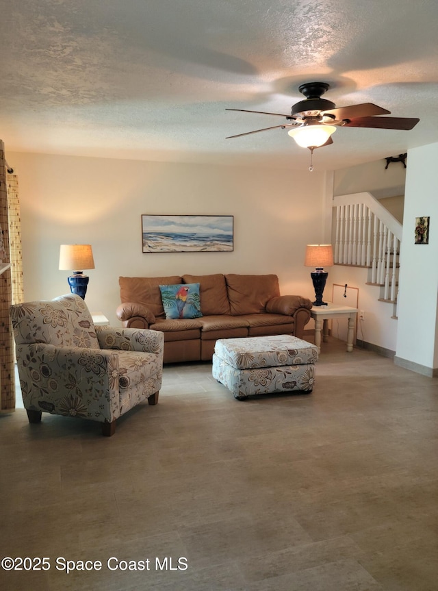 403 Hayes Ave, Cocoa Beach, FL 32931 - living room with stairs, a textured ceiling, and a ceiling fan