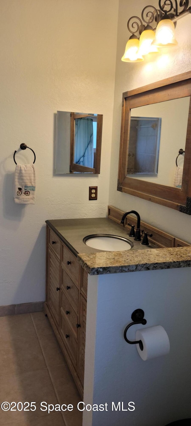 403 Hayes Ave, Cocoa Beach, FL 32931 - bathroom with vanity and tile patterned flooring