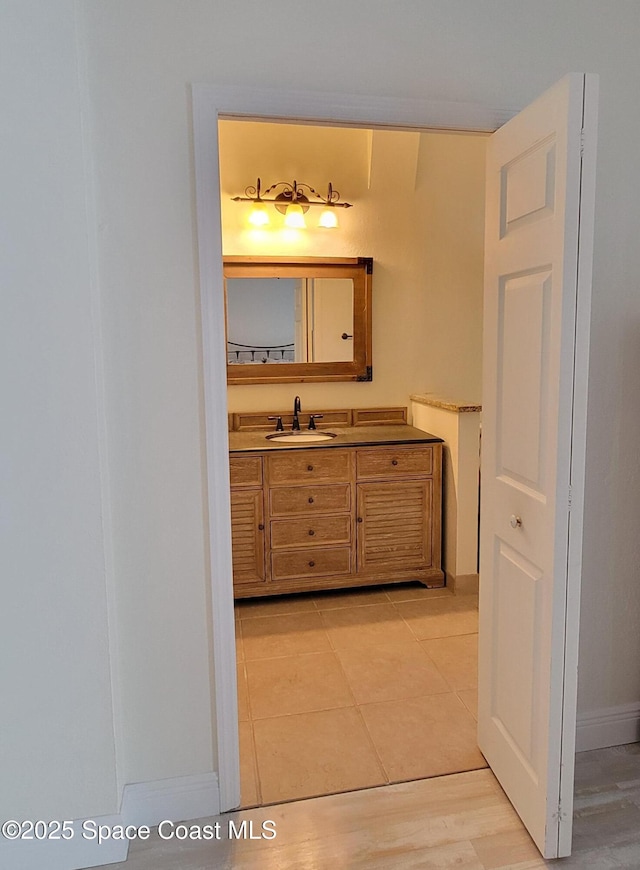 403 Hayes Ave, Cocoa Beach, FL 32931 - bathroom featuring vanity and baseboards