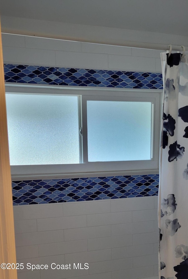 403 Hayes Ave, Cocoa Beach, FL 32931 - bathroom view of a shower with shower curtain