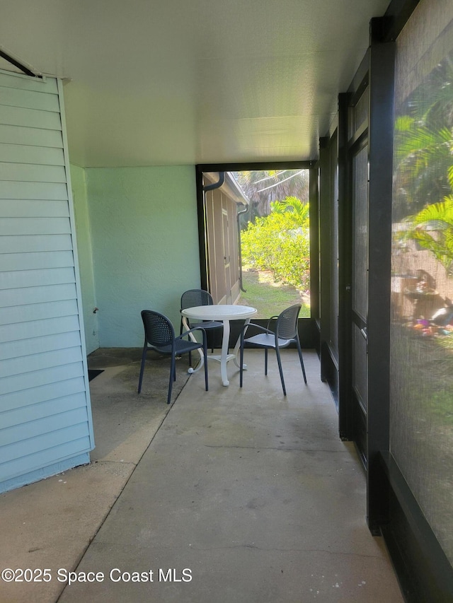 403 Hayes Ave, Cocoa Beach, FL 32931 - sunroom with outdoor dining area