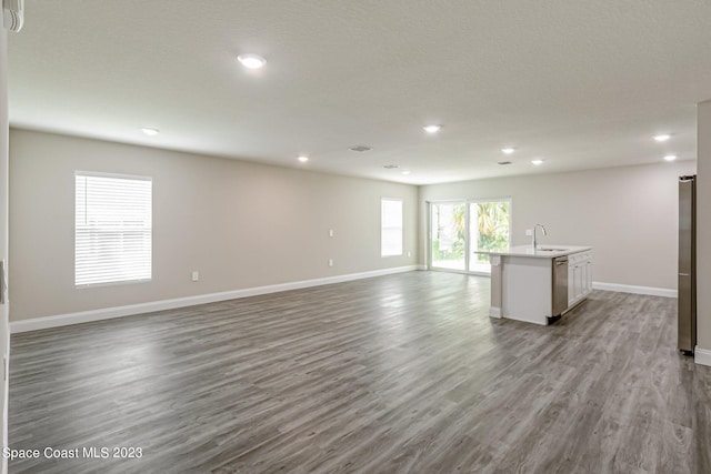 spare room featuring light hardwood / wood-style flooring and sink