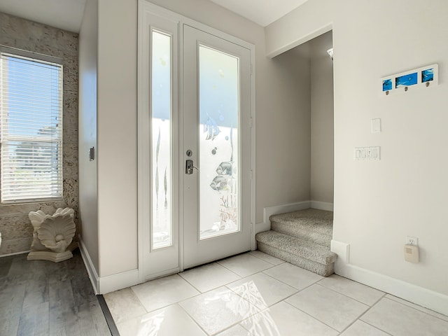 entryway featuring light tile patterned floors