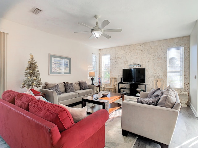 living room with ceiling fan, hardwood / wood-style flooring, and a wealth of natural light