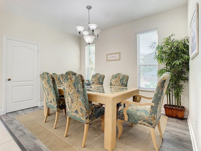 dining room featuring a chandelier and light wood-type flooring