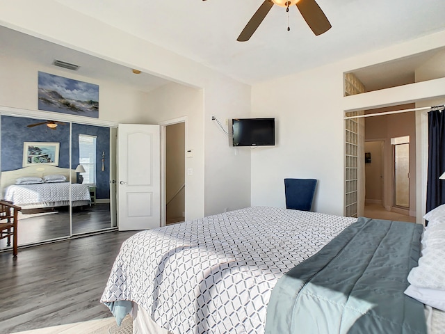 bedroom with a closet, ceiling fan, and wood-type flooring