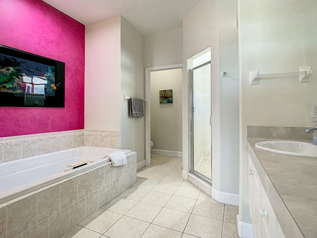 full bathroom with vanity, separate shower and tub, toilet, and tile patterned floors