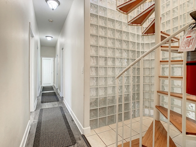 hallway with hardwood / wood-style floors