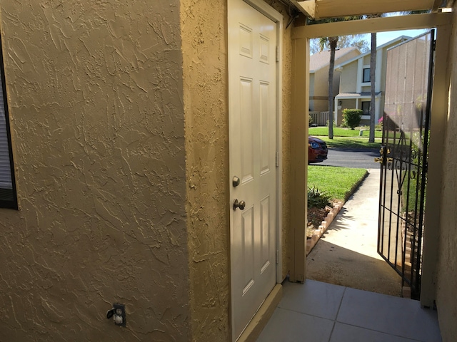 exterior space with light tile flooring