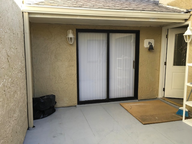 entrance to property with a patio area