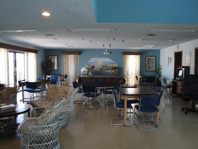 dining area with a textured ceiling