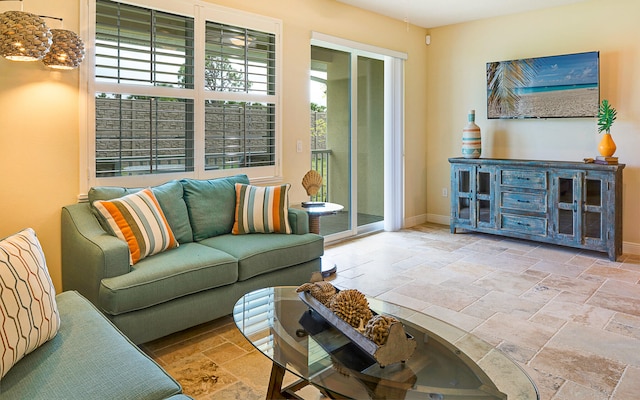 living room with light tile floors and a wealth of natural light