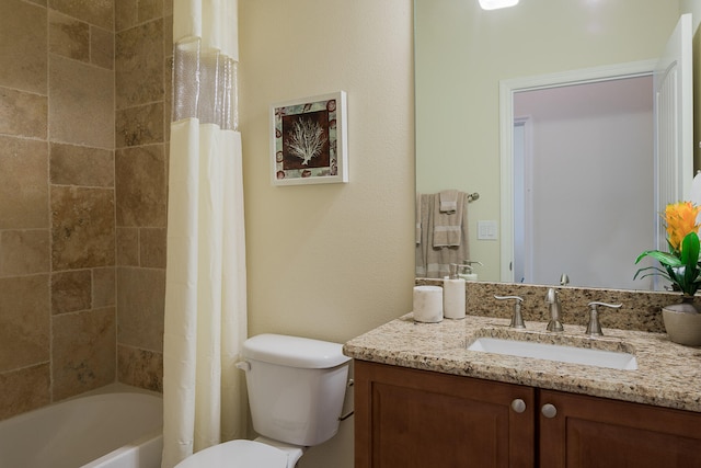 full bathroom featuring shower / bath combination with curtain, toilet, and vanity