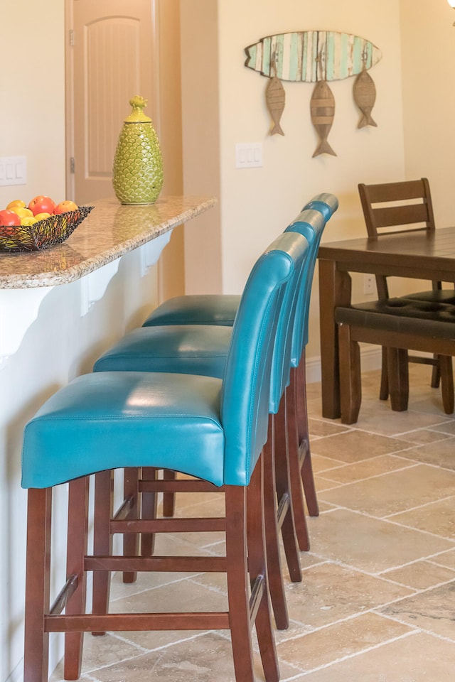 sitting room with light tile flooring