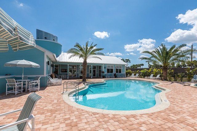 view of pool featuring a patio