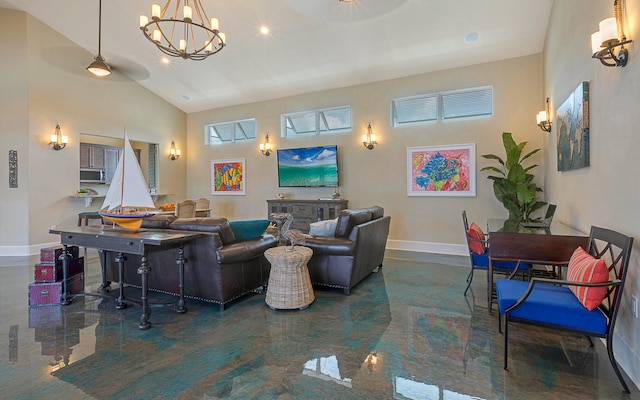 living room featuring high vaulted ceiling and a chandelier