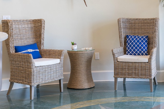 sitting room featuring dark tile floors