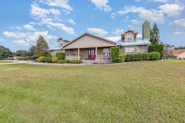 view of front of home featuring covered porch and a front lawn