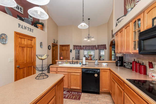 kitchen with light tile floors, decorative light fixtures, black appliances, sink, and an inviting chandelier