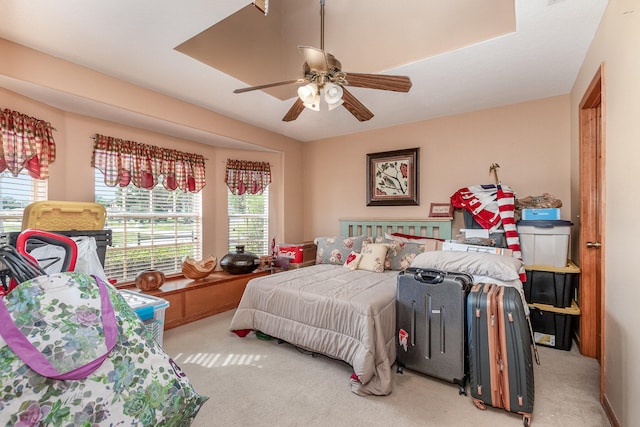 bedroom with light carpet and ceiling fan