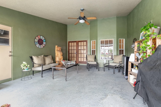 interior space featuring outdoor lounge area and ceiling fan