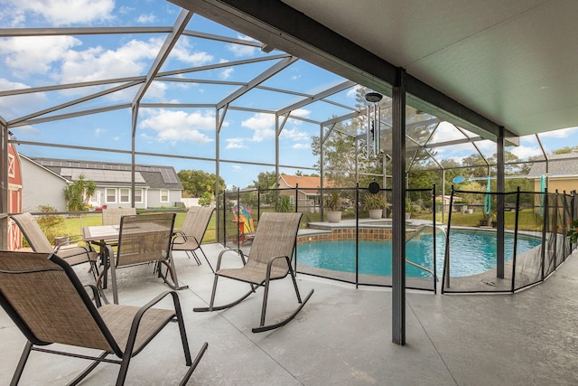 view of pool with a patio area and a lanai