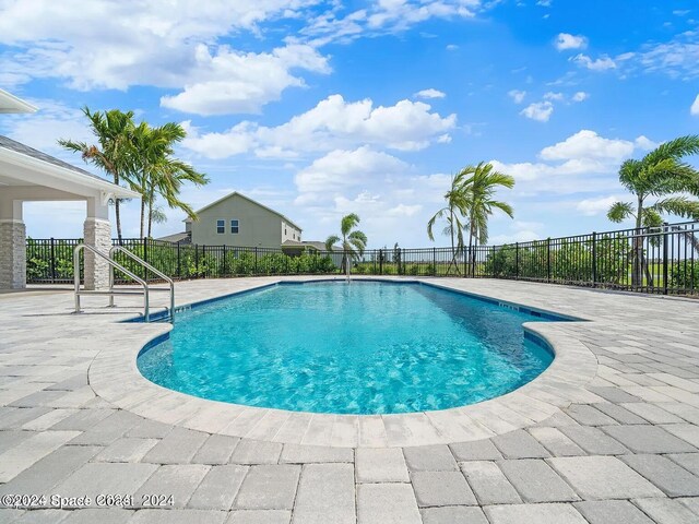 view of pool featuring a patio