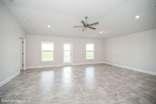 tiled spare room with ceiling fan and lofted ceiling