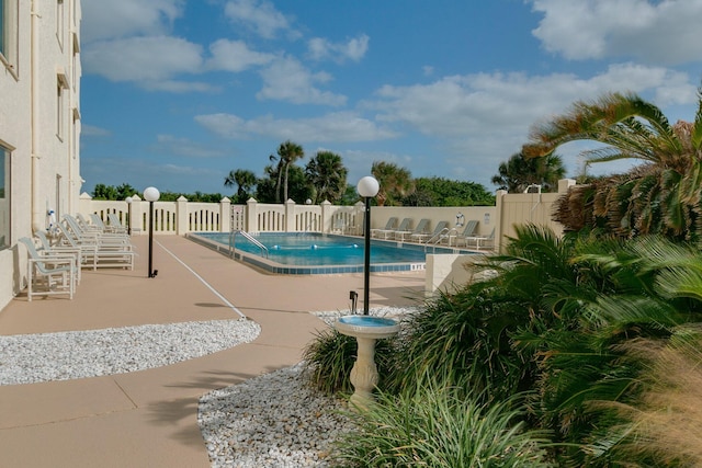 view of pool featuring a patio area