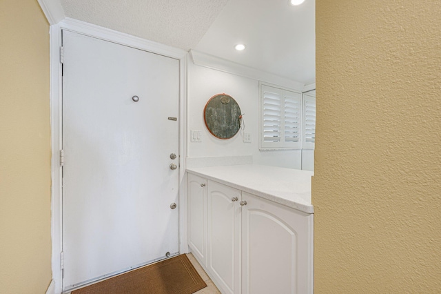 interior space featuring a textured ceiling