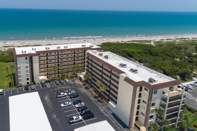 bird's eye view with a water view and a view of the beach