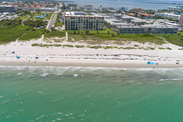 birds eye view of property featuring a water view and a view of the beach