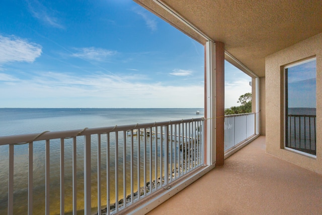 balcony featuring a water view