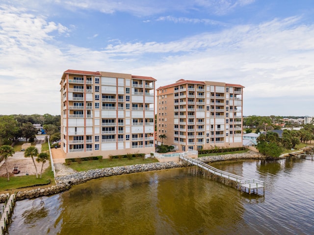 view of building exterior with a water view