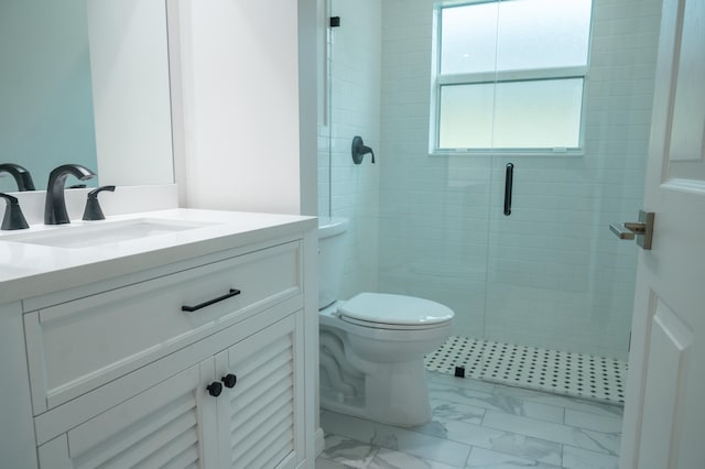 bathroom featuring toilet, vanity, a shower with door, and tile flooring