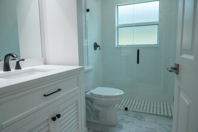 bathroom featuring toilet, tile floors, a shower with shower door, and vanity