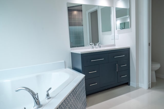 bathroom with a relaxing tiled bath, vanity, tile flooring, and toilet