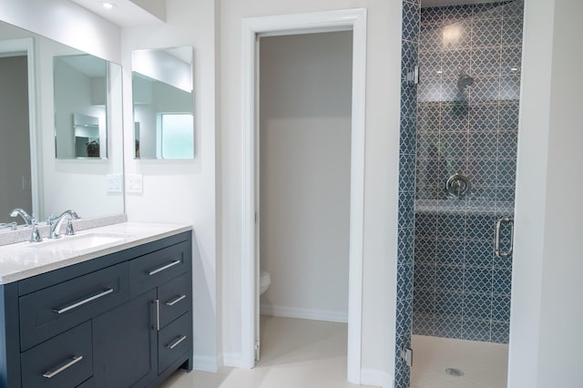 bathroom with oversized vanity, toilet, a shower with shower door, and tile flooring