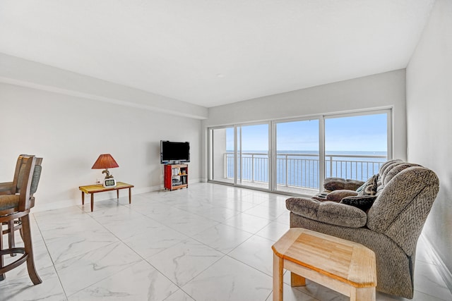 living room with plenty of natural light and light tile floors