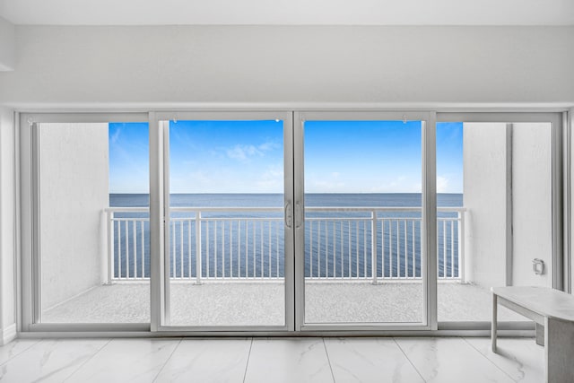 interior space featuring a healthy amount of sunlight and a water view