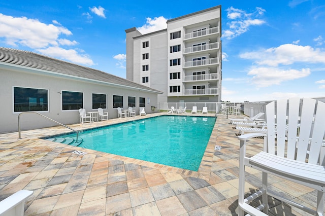 view of swimming pool featuring a patio