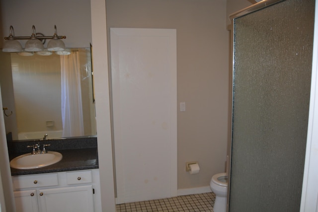 bathroom with oversized vanity, toilet, and tile floors