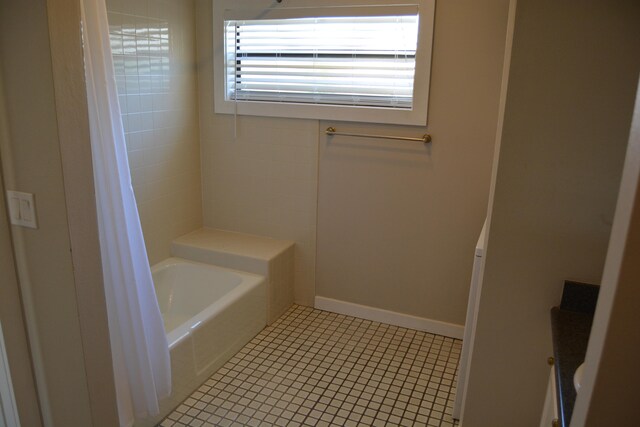 bathroom featuring tile flooring