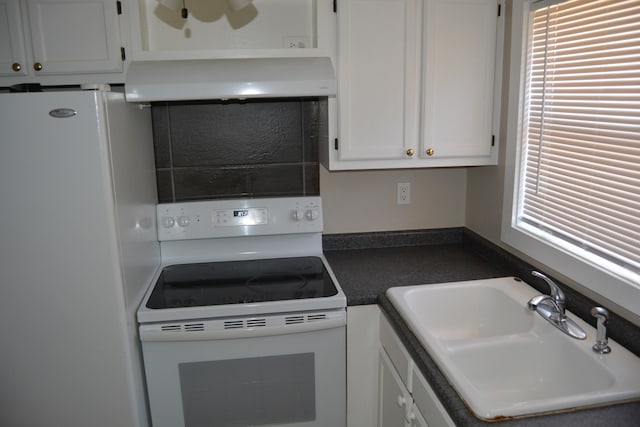 kitchen featuring white appliances, white cabinets, ventilation hood, and sink