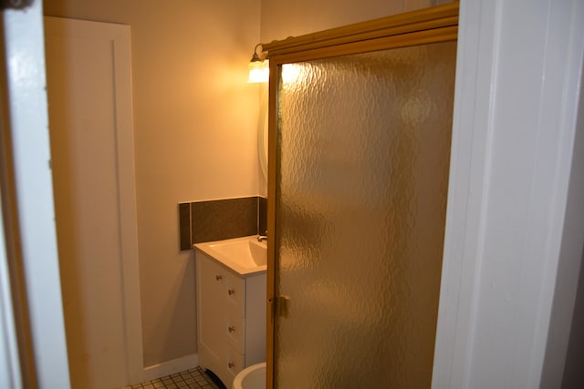 bathroom featuring tile floors and vanity