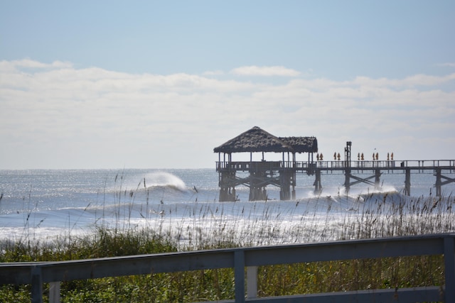 view of dock featuring a water view and a gazebo