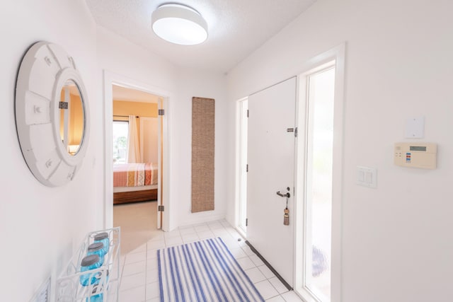 foyer entrance with light tile floors