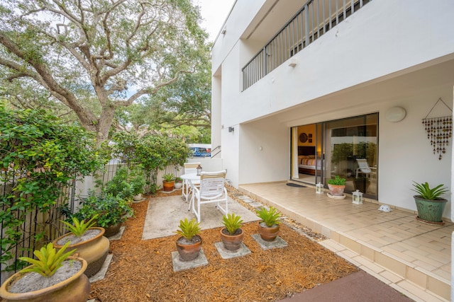 exterior space with a balcony and a patio