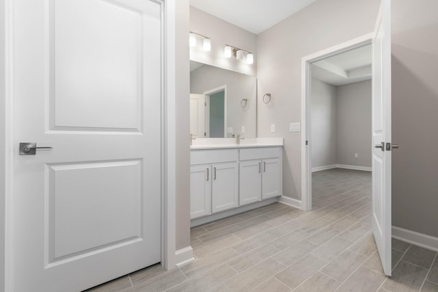 bathroom featuring vanity and wood-type flooring