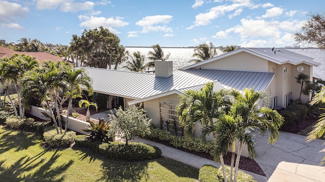 view of property exterior featuring a lawn